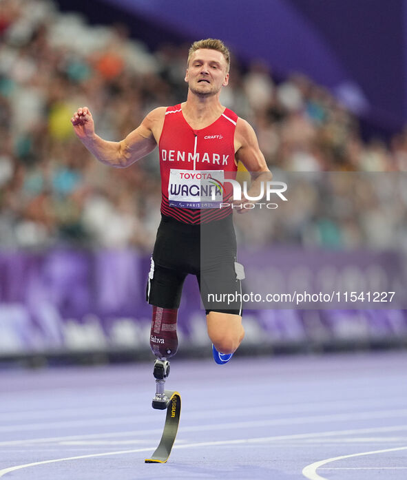 Daniel Wagner of Denmark celebrates winning silver in Men's 100m - T63 Final during the Paris 2024 Paralympic Games at Stade de France on Se...