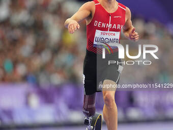 Daniel Wagner of Denmark celebrates winning silver in Men's 100m - T63 Final during the Paris 2024 Paralympic Games at Stade de France on Se...