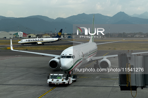 Ryanair and Aeroitalia planes are seen at the airport in Bergamo, Italy on September 2, 2024. 