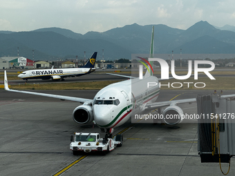 Ryanair and Aeroitalia planes are seen at the airport in Bergamo, Italy on September 2, 2024. (