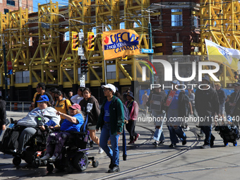 A large number of people participate in the Labour Day Parade in Downtown Toronto, Canada, on September 2, 2024. (