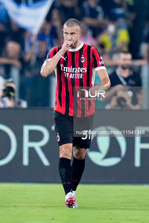 Strahinja Pavlovic of AC Milan celebrates after scoring first goal during the Serie A Enilive match between SS Lazio and AC Milan at Stadio...