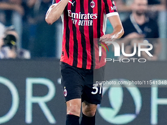 Strahinja Pavlovic of AC Milan celebrates after scoring first goal during the Serie A Enilive match between SS Lazio and AC Milan at Stadio...