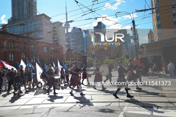 A large number of people participate in the Labour Day Parade in Downtown Toronto, Canada, on September 2, 2024. 