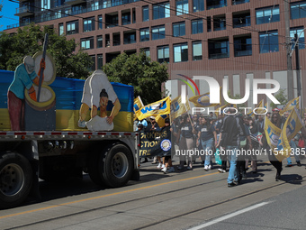 A large number of people participate in the Labour Day Parade in Downtown Toronto, Canada, on September 2, 2024. (