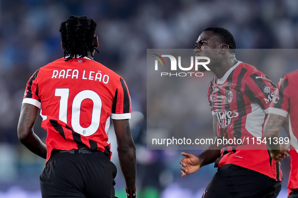 Rafael Leao of AC Milan celebrates with Youssouf Fofana after scoring second goal during the Serie A Enilive match between SS Lazio and AC M...