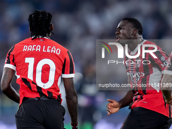 Rafael Leao of AC Milan celebrates with Youssouf Fofana after scoring second goal during the Serie A Enilive match between SS Lazio and AC M...