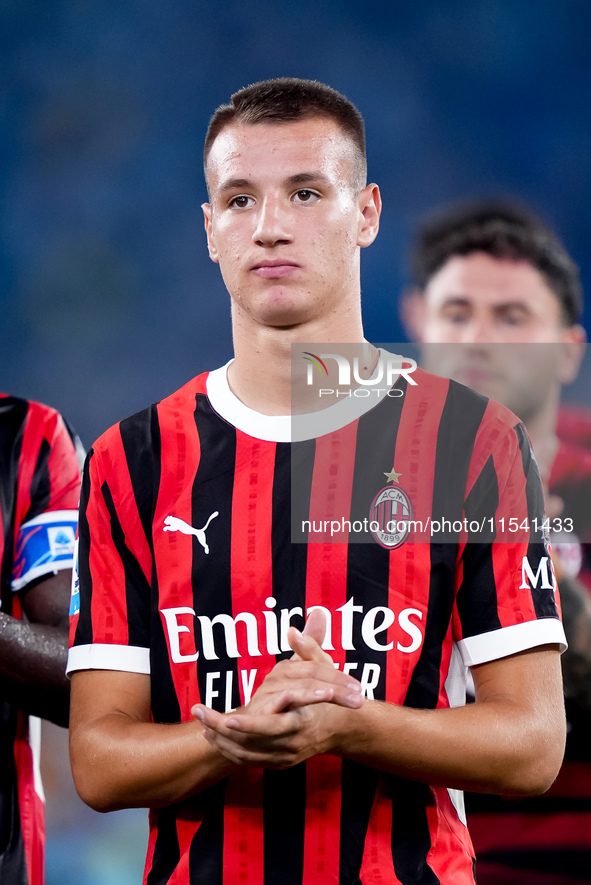 Francesco Camarda of AC Milan applauds his supporters during the Serie A Enilive match between SS Lazio and AC Milan at Stadio Olimpico on A...