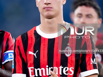 Francesco Camarda of AC Milan applauds his supporters during the Serie A Enilive match between SS Lazio and AC Milan at Stadio Olimpico on A...