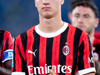 Francesco Camarda of AC Milan applauds his supporters during the Serie A Enilive match between SS Lazio and AC Milan at Stadio Olimpico on A...