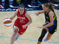 Indiana guard Caitlin Clark #22 drives to the basket against Dallas guard Jacy Sheldon #4 during the WNBA match at College Park Center. Indi...