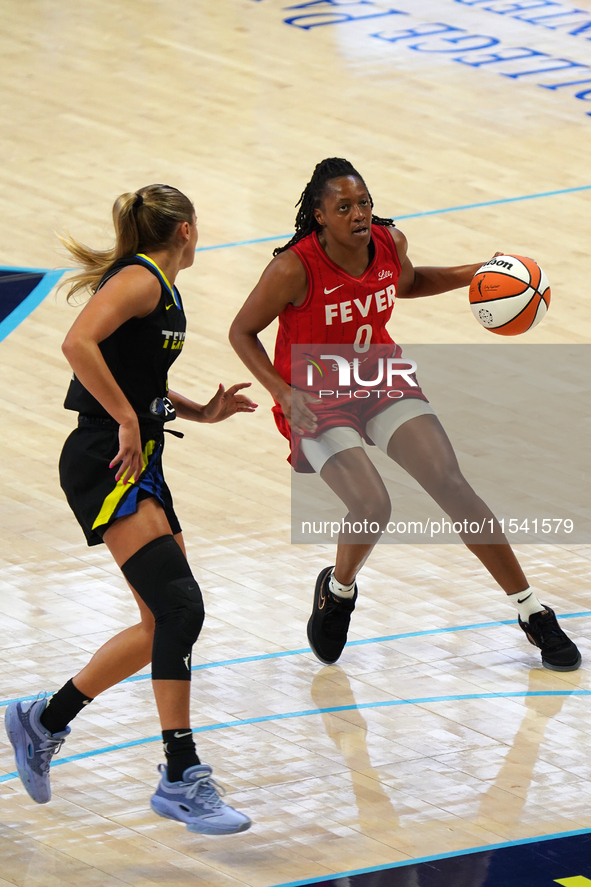 Indiana guard Kelsey Mitchell #0 handles the ball during the WNBA match against Dallas Wings at College Park Center. Indiana Fever defeat Da...