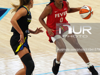 Indiana guard Kelsey Mitchell #0 handles the ball during the WNBA match against Dallas Wings at College Park Center. Indiana Fever defeat Da...