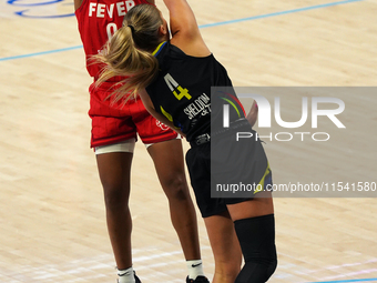 Indiana guard Kelsey Mitchell #0 shoots the ball over Dallas guard Jacy Sheldon #4 during the WNBA match against the Dallas Wings at College...