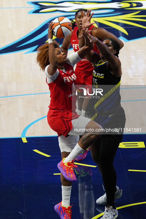 Indiana forward NaLyssa Smith #1 drives to the basket during the WNBA match against Dallas Wings at College Park Center. Indiana Fever defea...