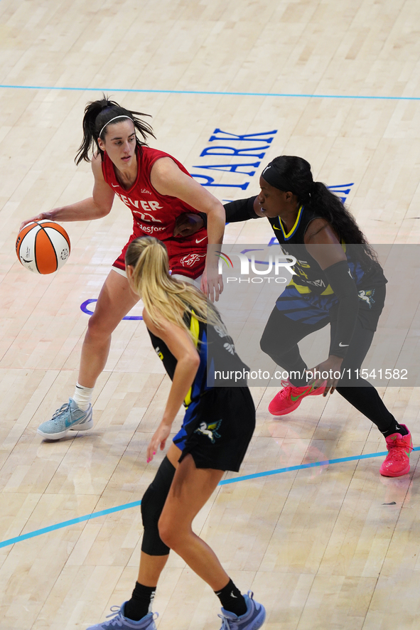 Indiana guard Caitlin Clark #22 handles the ball during the WNBA match against Dallas Wings at College Park Center. Indiana Fever defeat Dal...