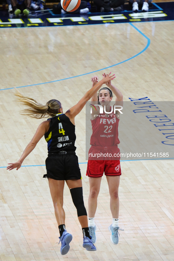 Indiana guard Caitlin Clark #22 shoots the ball over Dallas guard Jacy Sheldon #4 during the WNBA match against the Dallas Wings at College...