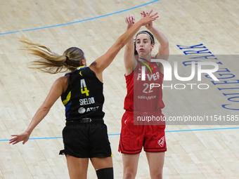 Indiana guard Caitlin Clark #22 shoots the ball over Dallas guard Jacy Sheldon #4 during the WNBA match against the Dallas Wings at College...