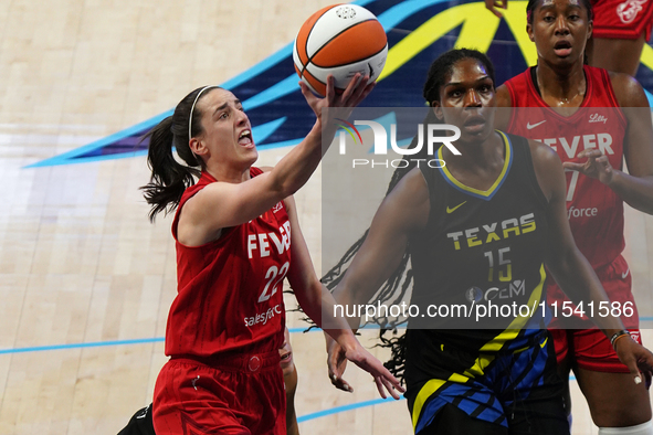 Indiana guard Caitlin Clark #22 drives to the basket during the WNBA match against Dallas Wings at College Park Center. Indiana Fever defeat...