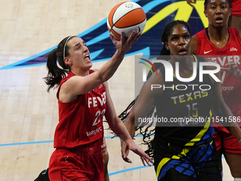 Indiana guard Caitlin Clark #22 drives to the basket during the WNBA match against Dallas Wings at College Park Center. Indiana Fever defeat...