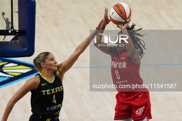 Kelsey Mitchell #0 shoots the ball during the WNBA match against the Dallas Wings at College Park Center. The Indiana Fever defeat the Dalla...