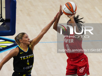 Kelsey Mitchell #0 shoots the ball during the WNBA match against the Dallas Wings at College Park Center. The Indiana Fever defeat the Dalla...