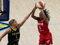 Kelsey Mitchell #0 shoots the ball during the WNBA match against the Dallas Wings at College Park Center. The Indiana Fever defeat the Dalla...