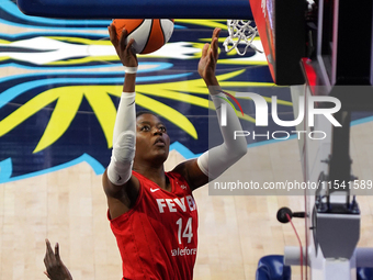 Indiana center Temi Fagbenle #14 drives to the basket during the WNBA match against Dallas Wings at College Park Center. Indiana Fever defea...