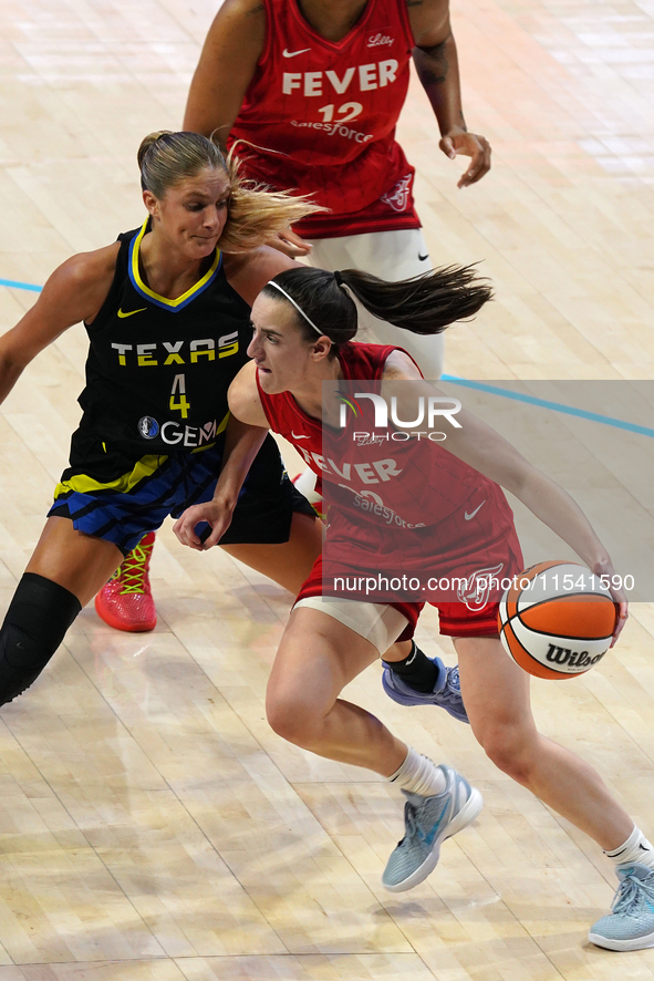 Indiana guard Caitlin Clark #22 handles the ball during the WNBA match against Dallas Wings at College Park Center. Indiana Fever defeat Dal...