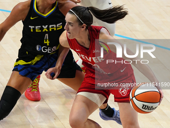 Indiana guard Caitlin Clark #22 handles the ball during the WNBA match against Dallas Wings at College Park Center. Indiana Fever defeat Dal...