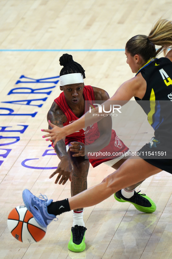 Indiana guard Erica Wheeler #17 passes the ball during the WNBA match against the Dallas Wings at College Park Center. Indiana Fever defeat...