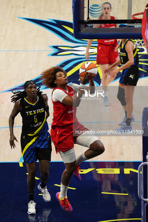 Indiana forward NaLyssa Smith #1 drives to the basket during the WNBA match against Dallas Wings at College Park Center. Indiana Fever defea...