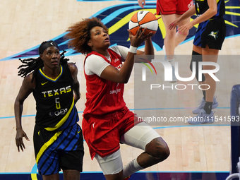 Indiana forward NaLyssa Smith #1 drives to the basket during the WNBA match against Dallas Wings at College Park Center. Indiana Fever defea...