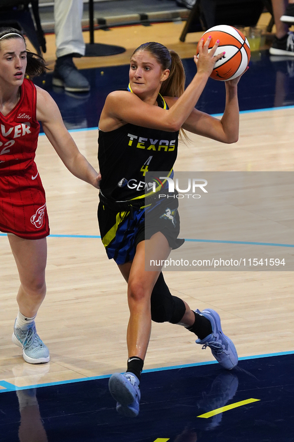 Dallas guard Jacy Sheldon #4 drives to the basket during the WNBA match against Indiana Fever at College Park Center. Indiana Fever defeat D...