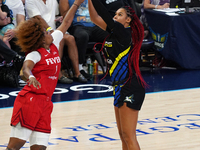 Dallas forward Satou Sabally #0 shoots the ball over Indiana forward NaLyssa Smith #1 during the WNBA match against Indiana Fever at College...