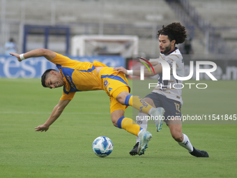 Cesar Huerta #12 of Pumas and Jesus Angulo #27 of Tigres battle for the ball during Matchday 6 as part of the Torneo de Apertura 2024 Liga M...