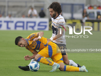 Cesar Huerta #12 of Pumas and Jesus Angulo #27 of Tigres battle for the ball during Matchday 6 as part of the Torneo de Apertura 2024 Liga M...