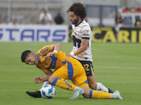 Cesar Huerta #12 of Pumas and Jesus Angulo #27 of Tigres battle for the ball during Matchday 6 as part of the Torneo de Apertura 2024 Liga M...