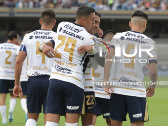 Rogelio Funes Mori #29 of Pumas celebrates after scoring a goal during Matchday 6 against Tigres as part of the Torneo de Apertura 2024 Liga...