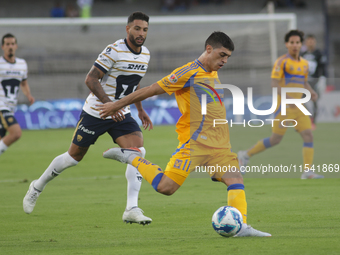 Juan Brunetta #11 of Tigres shoots the ball during Matchday 6 against Pumas as part of the Torneo de Apertura 2024 Liga MX at Estadio Olimpi...