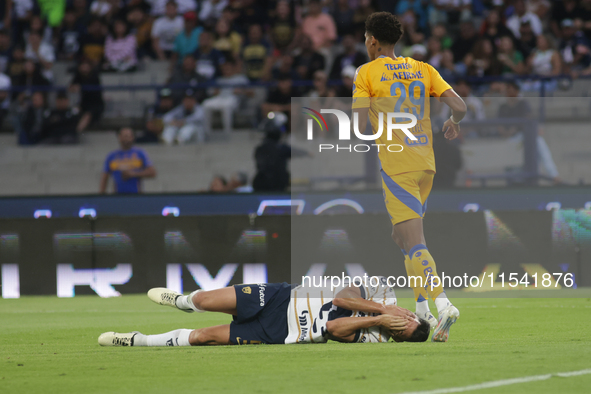 Ruben Duarte #5 of Pumas receives a foul by Jonathan Herrera #29 of Tigres during Matchday 6 as part of the Torneo de Apertura 2024 Liga MX...