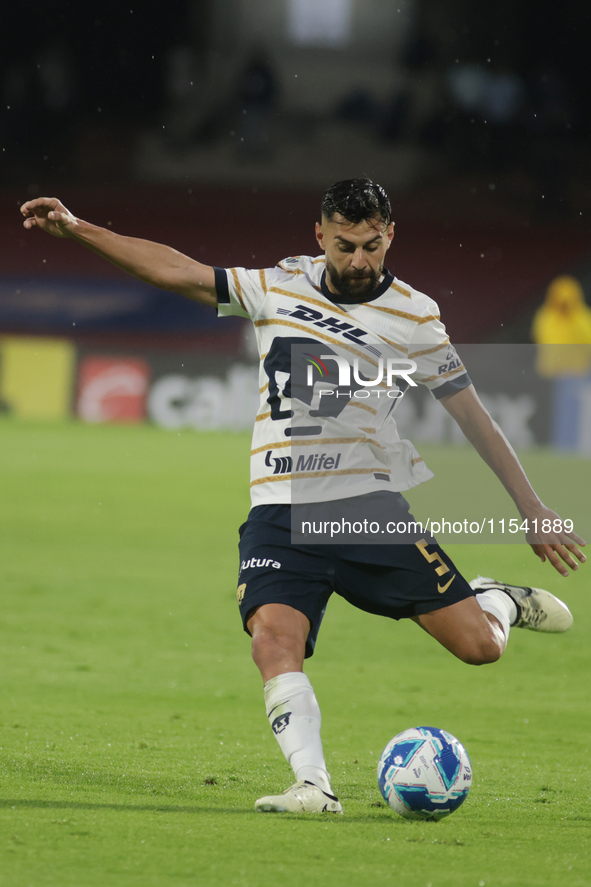 Ruben Duarte #5 of Pumas kicks the ball during Matchday 6 against Tigres as part of the Torneo de Apertura 2024 Liga MX at Estadio Olimpico...