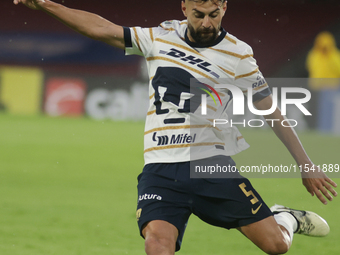 Ruben Duarte #5 of Pumas kicks the ball during Matchday 6 against Tigres as part of the Torneo de Apertura 2024 Liga MX at Estadio Olimpico...