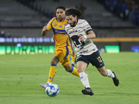 Cesar Huerta #12 of Pumas drives the ball during Matchday 6 against Tigres as part of the Torneo de Apertura 2024 Liga MX at Estadio Olimpic...