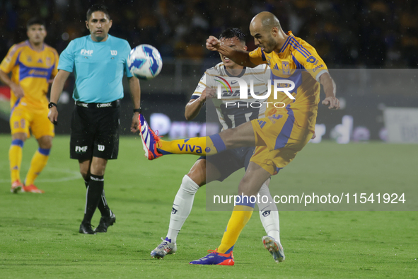 Guido Pizarro #19 of Tigres shoots the ball during Matchday 6 against Pumas as part of the Torneo de Apertura 2024 Liga MX at Estadio Olimpi...