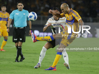 Guido Pizarro #19 of Tigres shoots the ball during Matchday 6 against Pumas as part of the Torneo de Apertura 2024 Liga MX at Estadio Olimpi...