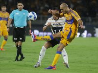 Guido Pizarro #19 of Tigres shoots the ball during Matchday 6 against Pumas as part of the Torneo de Apertura 2024 Liga MX at Estadio Olimpi...