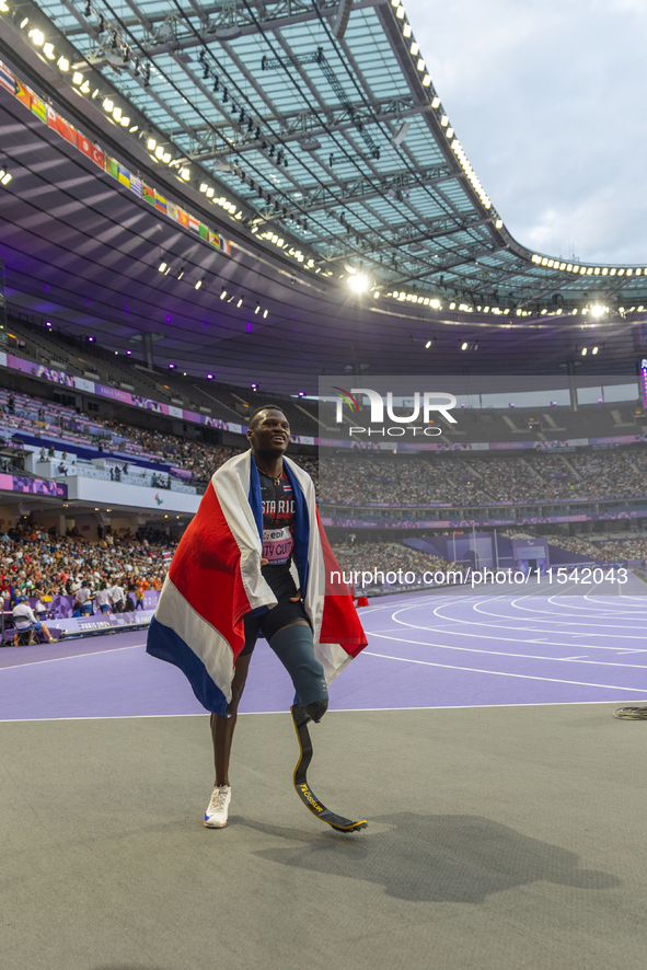 Sherman Isidro Guity Guity of Costa Rica reacts after winning the gold medal in the Men's 100m - T64 Final at Stade de France during the Par...