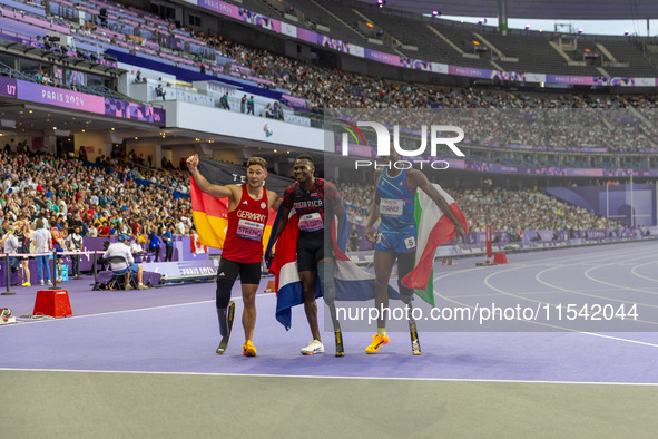 STRENG Felix of Germany (L), Sherman Isidro Guity Guity of Costa Rica (C), and MANU Maxcel Amo of Italy (R) react after the Men's 100m - T64...