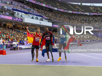 STRENG Felix of Germany (L), Sherman Isidro Guity Guity of Costa Rica (C), and MANU Maxcel Amo of Italy (R) react after the Men's 100m - T64...